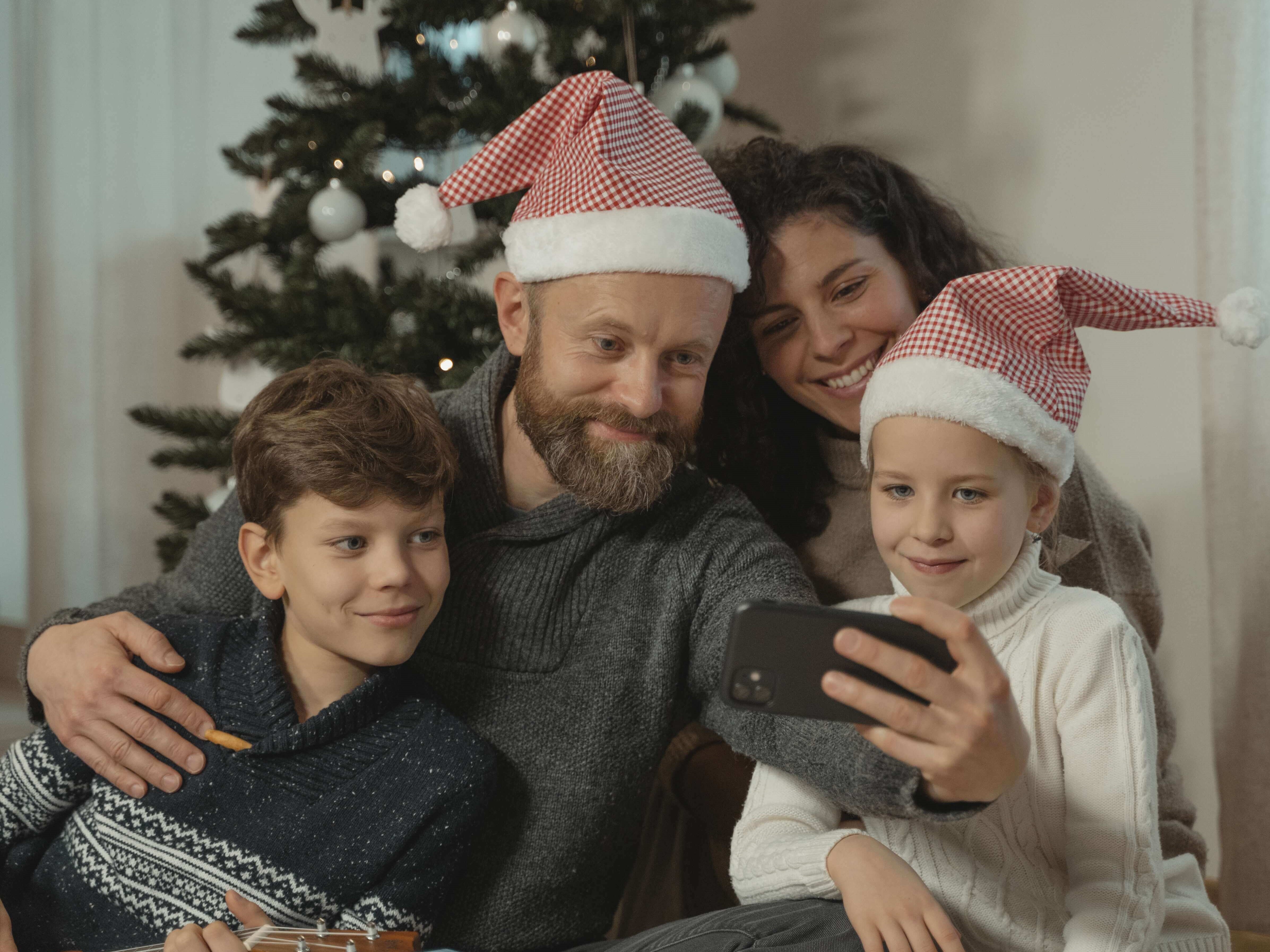 A family of four taking a selfie